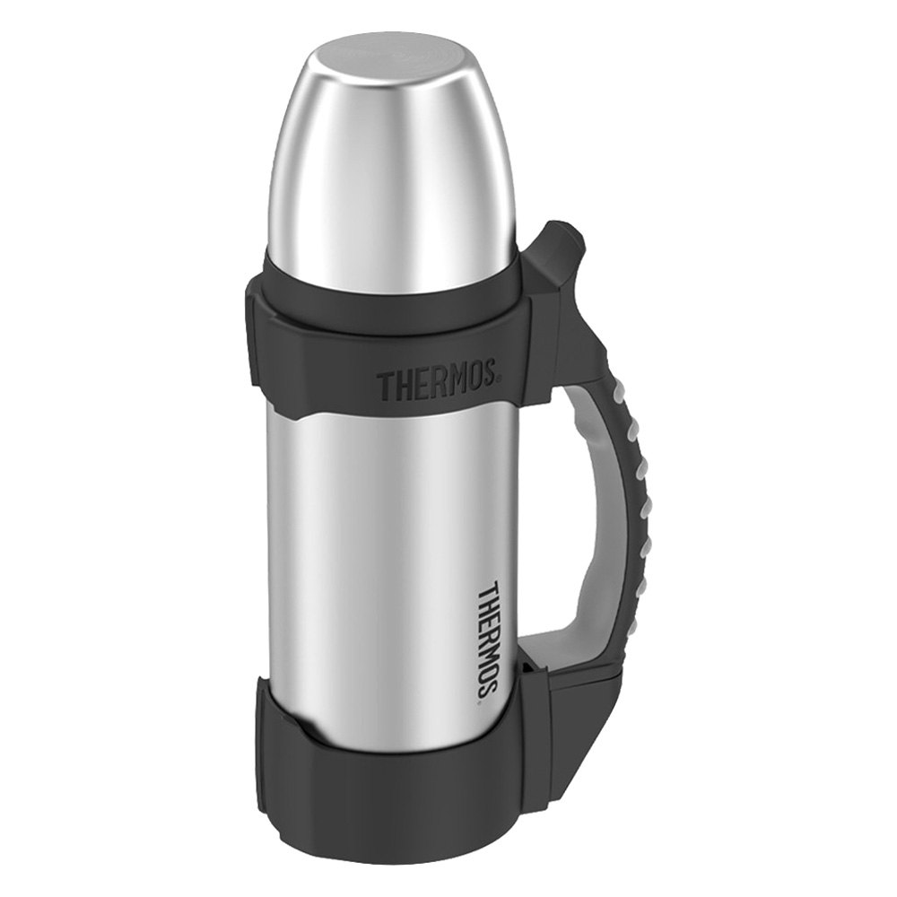 Aluminium Thermos with Hot Drink on Rock Stone Outdoors. Space for